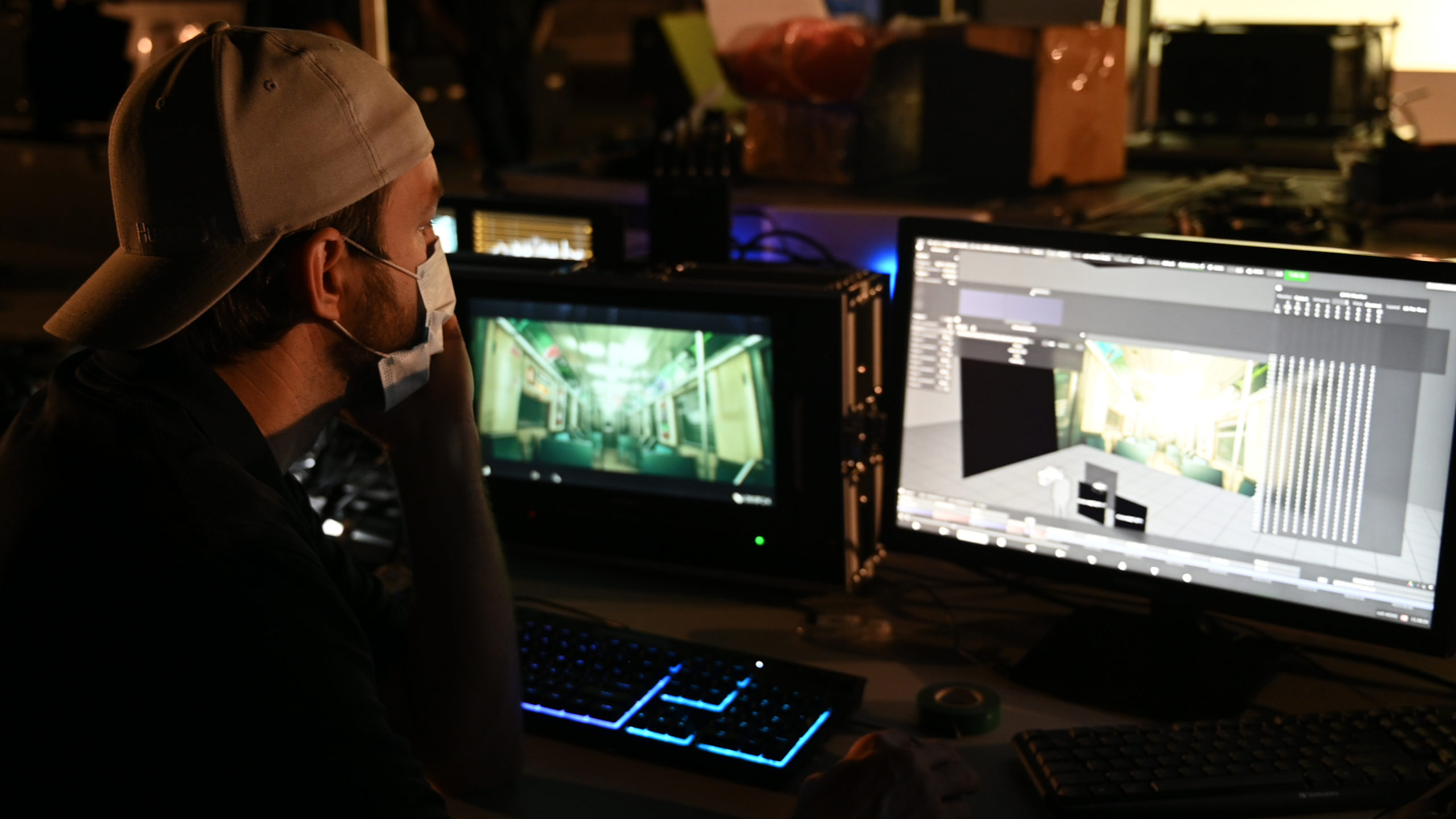 A man sitting in front of a computer screen.