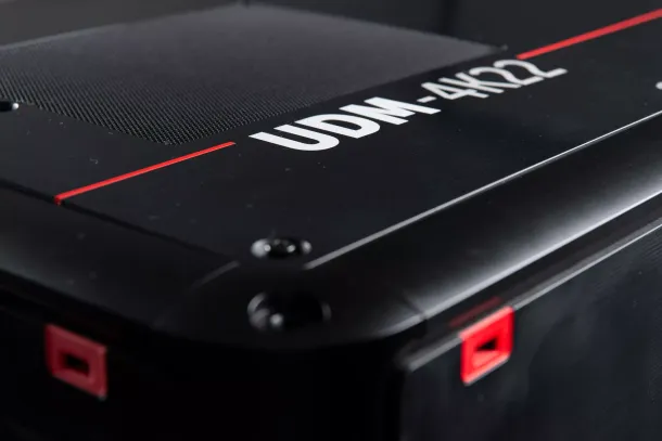A close up of a black computer case with the word udm on it.